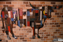 Steak house turned music venue cow art
